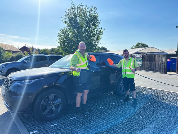 Staff at the Old Railway Line Garden Centre hard at work during their charity car wash
