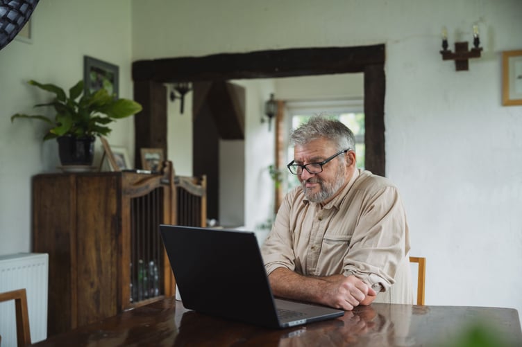 Mark says satellite broadband has transformed his life, allowing him to communicate more easily in British Sign Language and stay connected from his rural Powys home