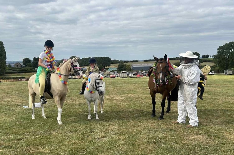 Riders and their horses show off their fancy dress outfits