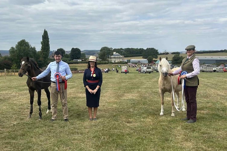 Left is the Horse Section Champion right is the Reserve Champion, pictured with judge Mrs M Lewis