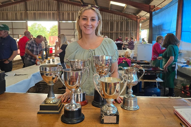Kayleigh Prothero with her sheep cups, including Interbreed Champion