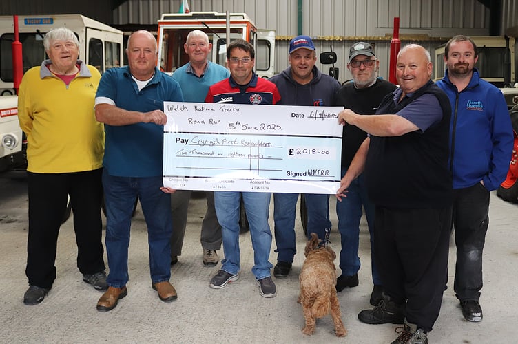 Glyn Vaughan of Crymych First Responders receiving a cheque