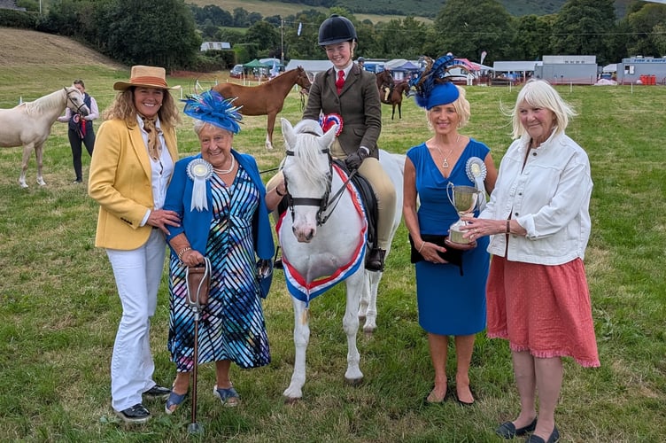 Grace Davies with Dusty, winning Supreme Champion in the Horse Section