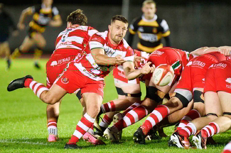 Llandovery captain Lee Rees gets the ball away