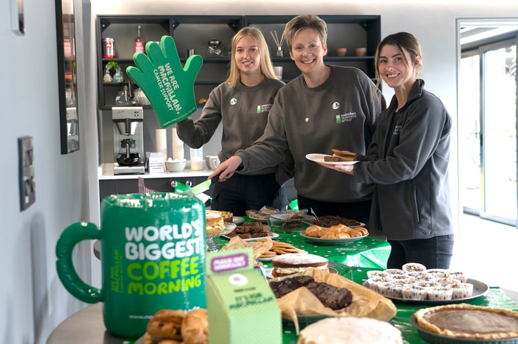 Pictured at last year’s Marches Coffee Morning are employees Lara Hall, Clare Morris, and Clare Wells