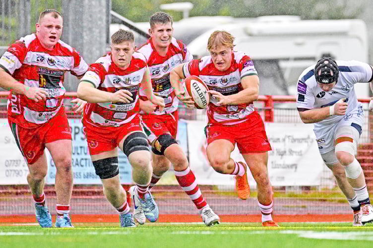 Scrum half George MacDonald burst clear, supported from left to right by Jamie Hughes, Osian Davies and Joe Powell