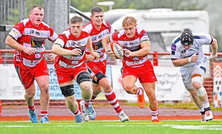 Scrum half George MacDonald burst clear, supported from left to right by Jamie Hughes, Osian Davies and Joe Powell