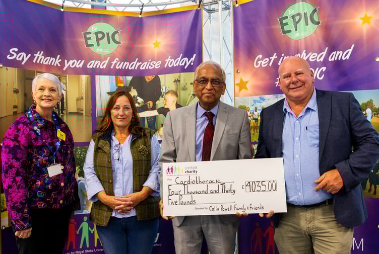 Colin Powell (right) and his wife, Mandy (second from left) present the cheque to consultant cardiac surgeon Mr Qamar Abid watched by UHNM Charity director, Lisa Thomson.