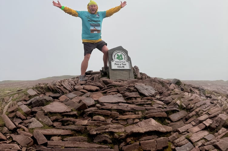 Chris Daniel has celebrated his record-breaking 366th climb of Pen y Fan, raising thousands for Bowel Cancer UK in memory of his late wife, Rita