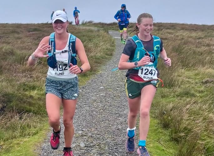 Two runners reach the summit in the Waun Fach fell race