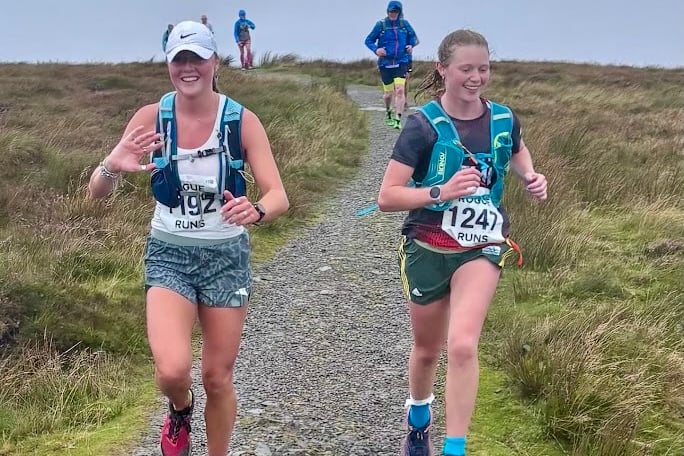 Two runners reach the summit in the Waun Fach fell race