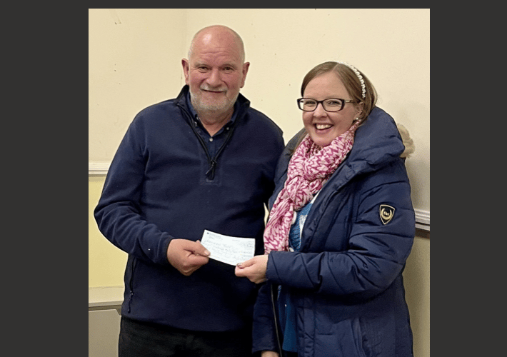 Chairman, Aubrey Powell presenting the cheque to Fund Raiser, Emma Coates.
