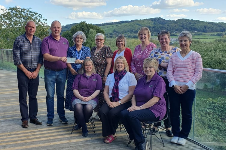 Volunteers from the Penybont and District Charity Group present a cheque for £1,500 to St Michael’s Hospice following this year’s tractor run