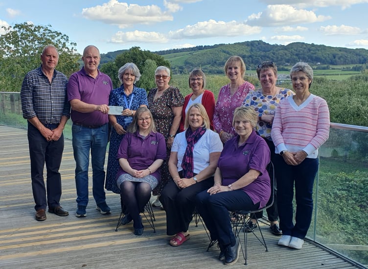 Volunteers from the Penybont and District Charity Group present a cheque for £1,500 to St Michael’s Hospice following this year’s tractor run