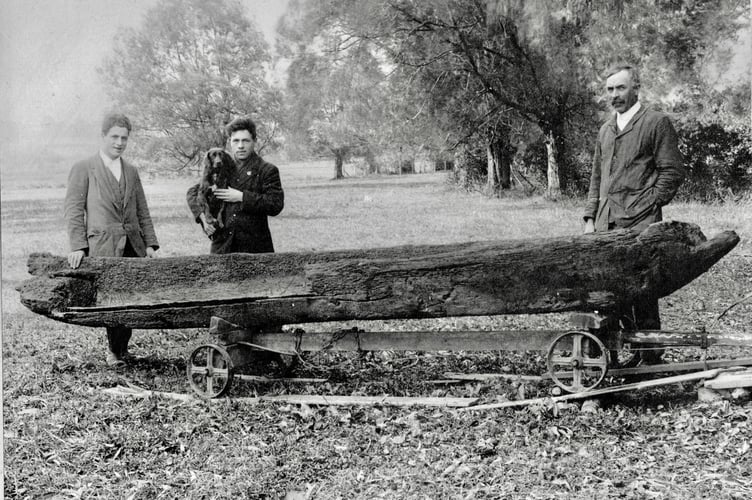 Thomas Jenkins and his two sons with the logboat