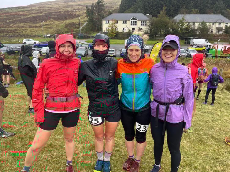 Some of the runners at Storey Arms braced against the elements. Photo: Ellie Salisbury