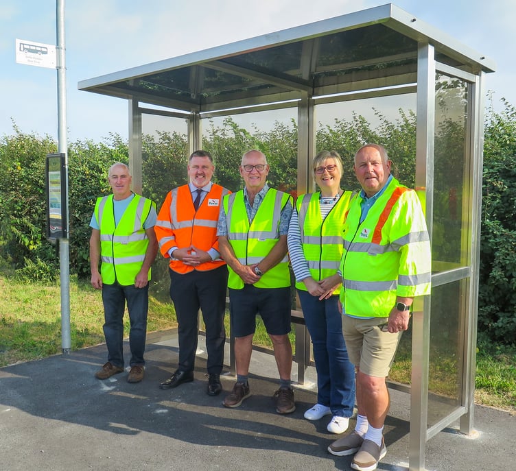 The handover of the Cilmery bus shelter, attended by Matt Perry, Cllr Bryan Davies, and members of Cilmery Community Council