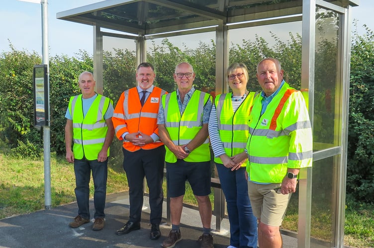 The handover of the Cilmery bus shelter, attended by Matt Perry, Cllr Bryan Davies, and members of Cilmery Community Council