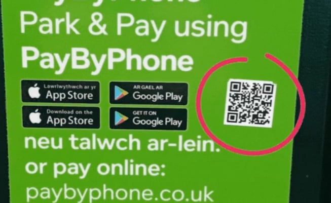 An example of a scam QR code at a Powys car park