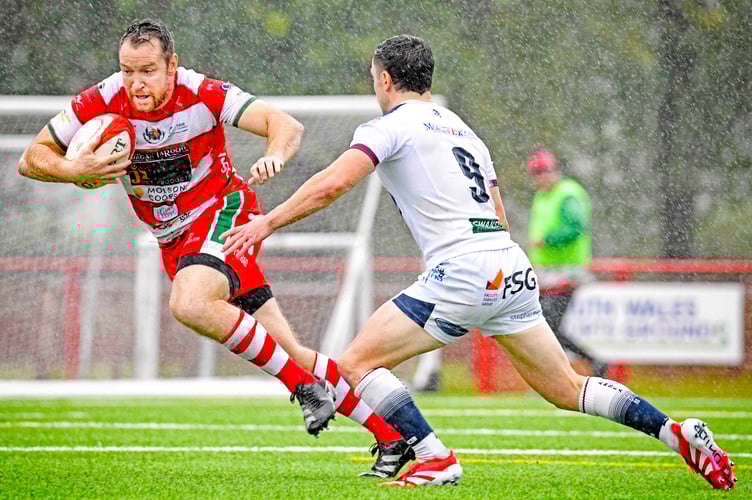 Adam Warren slips defender