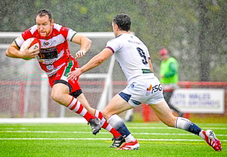 Adam Warren slips defender