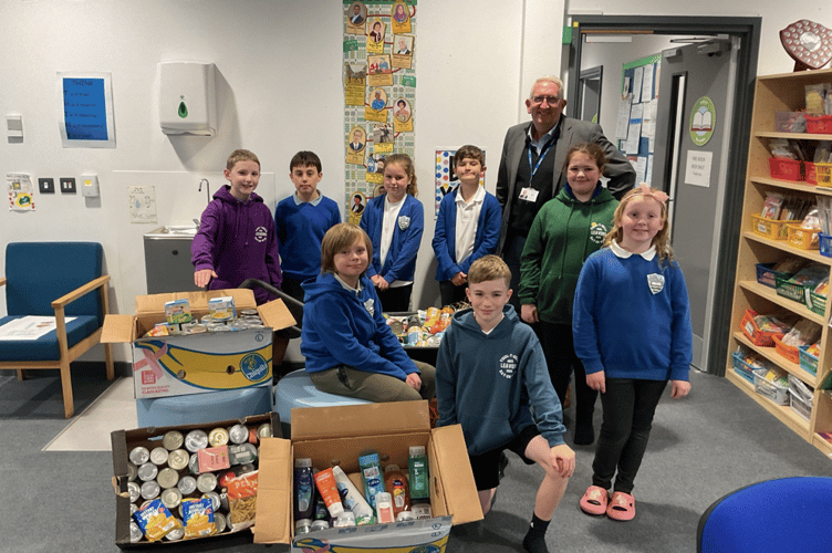 Some members of the school council with headteacher Richard Morris and the donations for Brecon Food Bank, collected on Monday, October 20