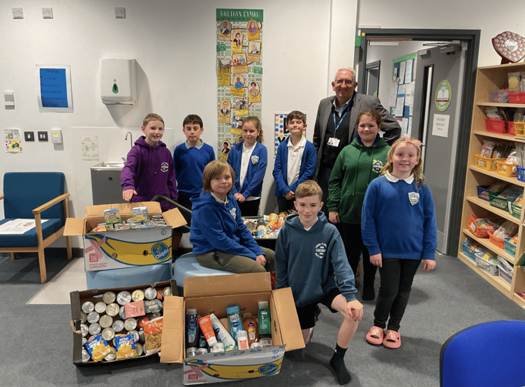 Some members of the school council with headteacher Richard Morris and the donations for Brecon Food Bank, collected on Monday, October 20