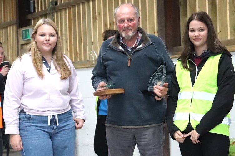 Corah and her grandfather Hayden Milward being presented with the award for the best modern tractor