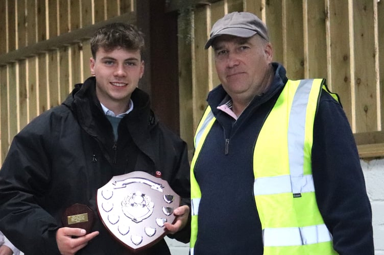 Andrew Ritchie presenting Nathan Davies with the best vintage tractor award