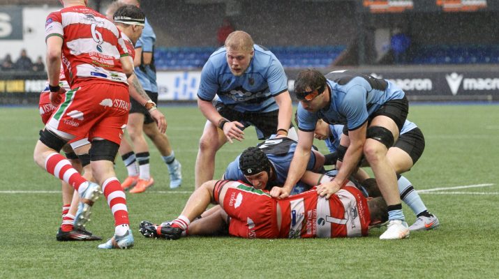 Llandovery No 7 Jordan Evans caught by the Cardiff defence