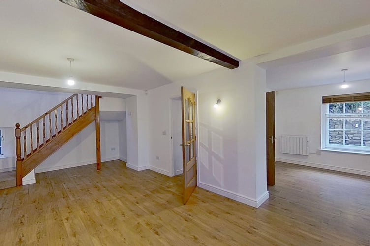 The three-bedroom house features a private garden and access to communal amenities