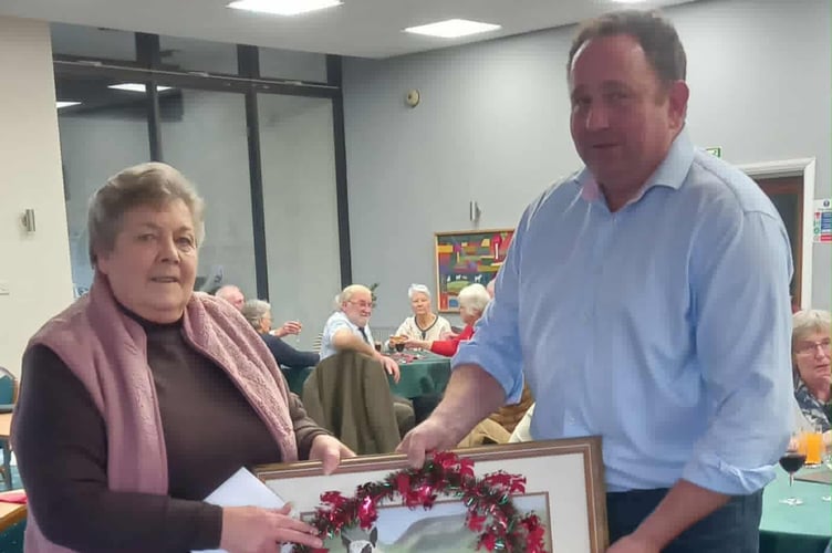 Pam was presented with the retirement gift by NSA Wales & Border Ram Sale Chairman, Geoff Probert