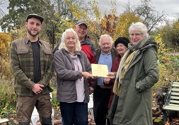 A presentation of the plaque to the Community Garden in Presteigne