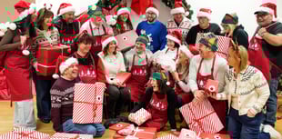 £1 million lottery winners from Brecon help pack toys for children