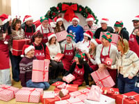 £1 million lottery winners from Brecon help pack toys for children