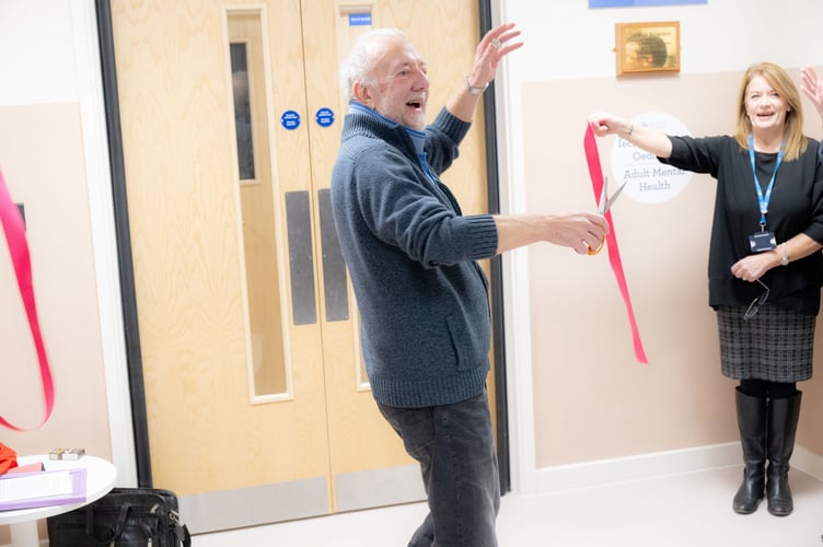 Austin Allen, partner of the late Drew Richardson, unveils a plaque dedicating the new Richardson Centre