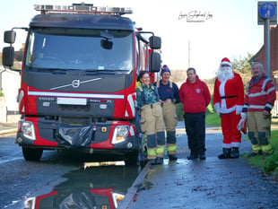 Firefighters turn Santa for a day to help local families