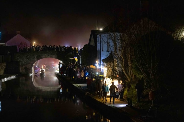 Hundreds gathered along the towpath in Brecon as the canal was lit up