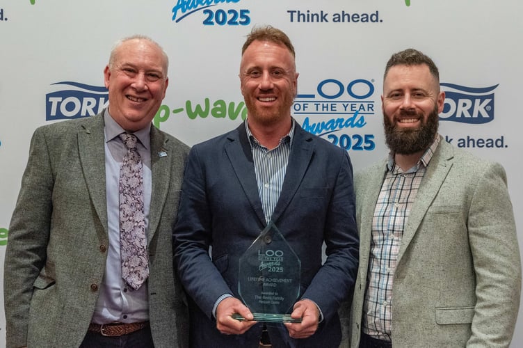 Gerwyn Rees with his sons Craig and Morgan collecting the Lifetime Achievement Award at the Loo of the Year Awards