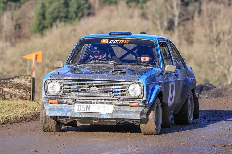 Jonathan Young and co-driver Sam Weller struggle for traction in the slippery conditions