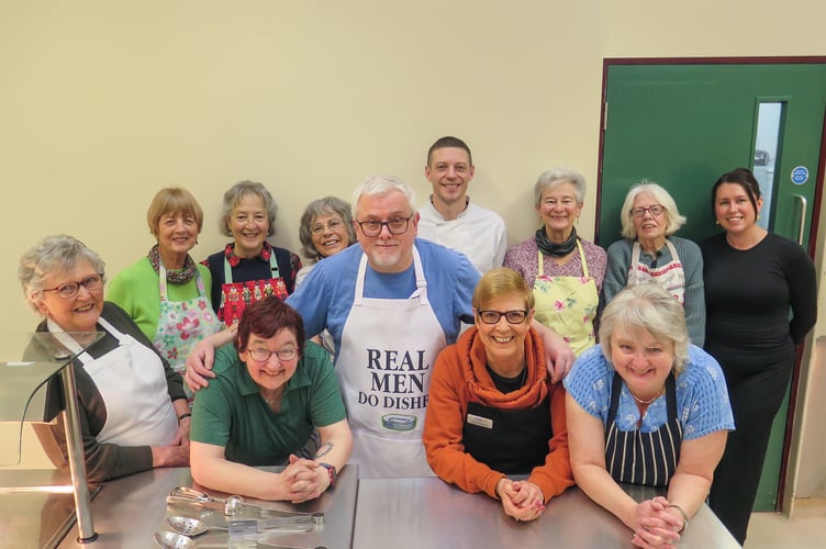 The dedicated Rotary ladies and head chef Nick get ready to serve a festive feast