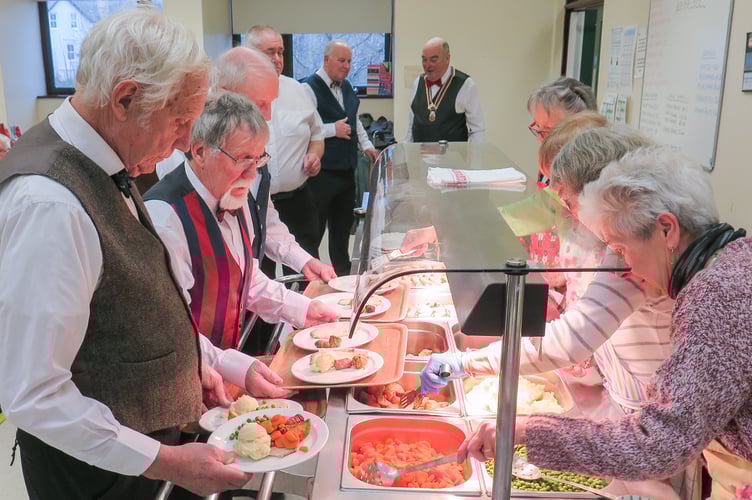 Rotarians preparing to serve the meals