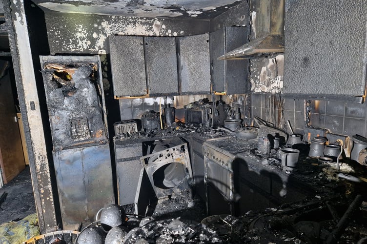 Damage inside the property following a tumble dryer fire in Bronllys