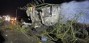 Lorry overturns and catches fire on Powys A-road