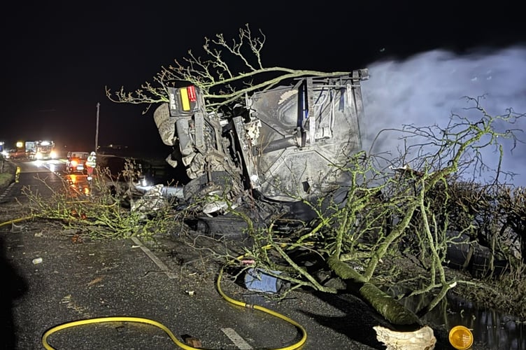 A heavy goods vehicle overturned and caught fire on Monday evening
