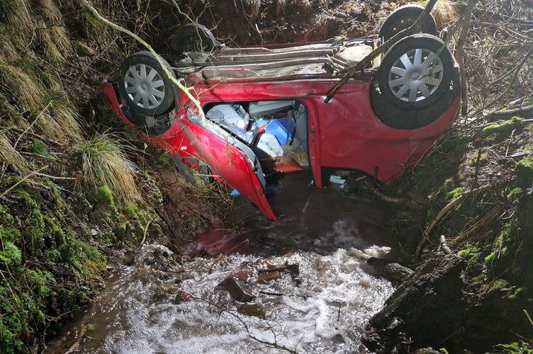 Crews carried out a rapid rescue after the vehicle came to rest on its roof in a stream at Pengenffordd.