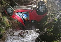 Trapped driver rescued after car overturns into stream near Talgarth