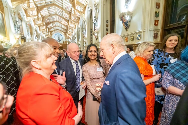Carol Dight, Taurai Zimbi, Mario Kreft MBE and Shiny Skaria chatting to King Charles at the Windsor Castle reception