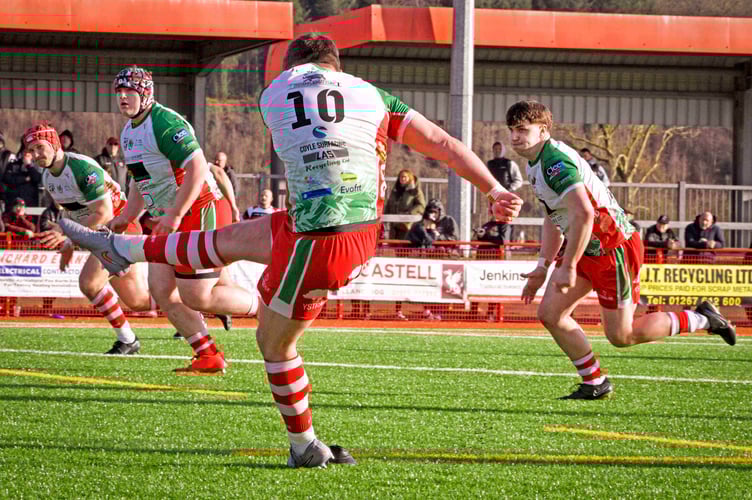 Ioan Hughes kicks the match-winning penalty