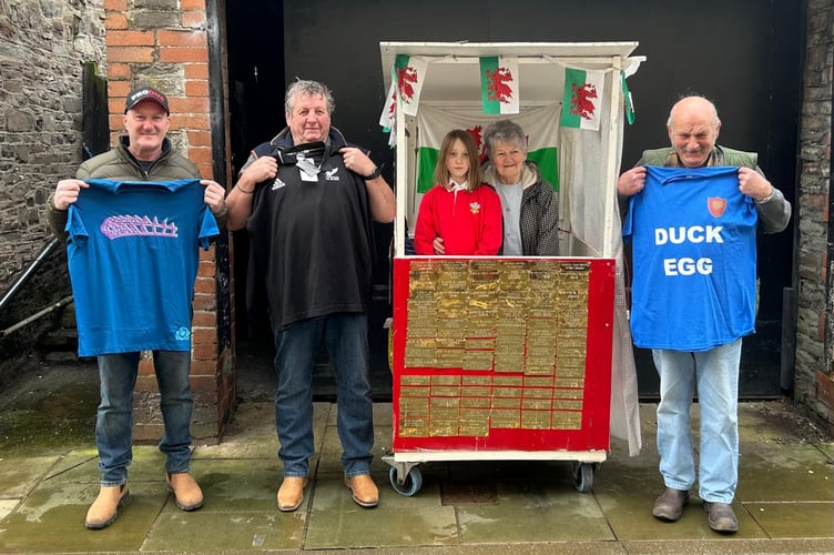 The first batch of winners gather with Lorna Keylock, who is pictured in the TARDIS kiosk